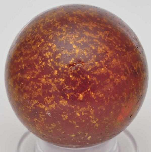 Appraisal: Large Amber Mica Marble Description Amber glass with nice evenly