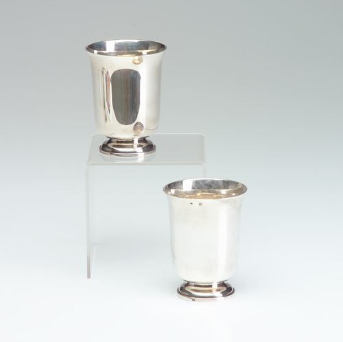 Appraisal: JEAN E PUIFORCAT Pair of French silver footed beakers with