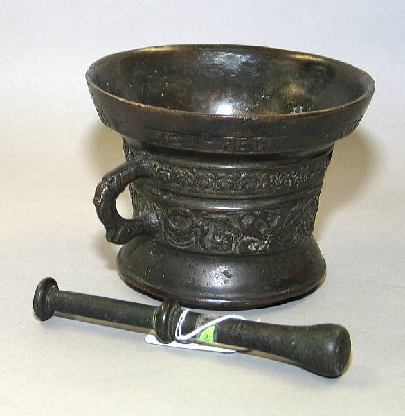 Appraisal: A Flemish bronze mortar dated Of waisted form with a