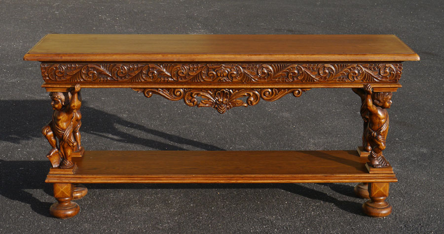 Appraisal: STENCEL FIGURAL CARVED OAK SOFA OR FOYER TABLE Carved apron