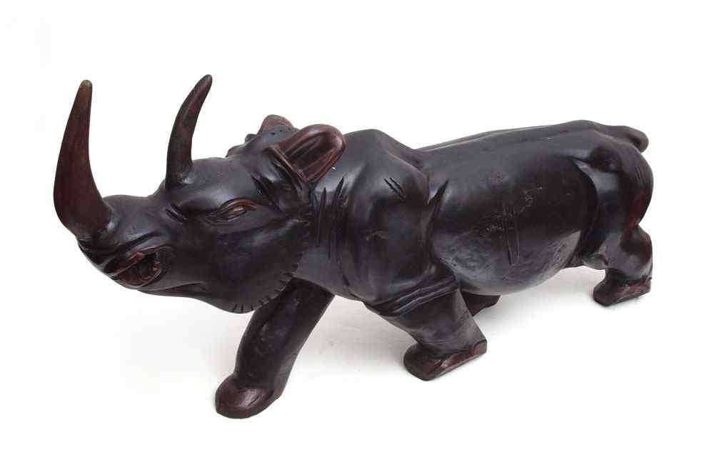 Appraisal: CARVED AFRICAN MAHOGANY CARVED RHINO GUINEA ''h x ''l x