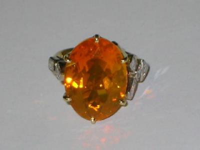 Appraisal: A FIRE OPAL AND DIAMOND DRESS RING the large oval