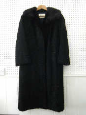 Appraisal: A full length Persian lamb and fur collar coat by