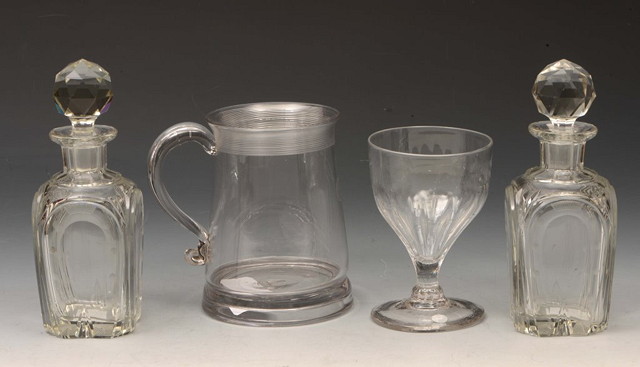 Appraisal: A PAIR OF SMALL FLUTED GLASS BOTTLES and stoppers with