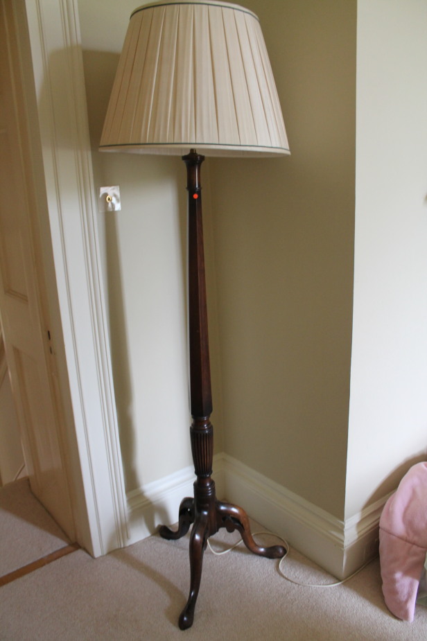 Appraisal: A Victorian mahogany standard lamp with tripod base and pleated