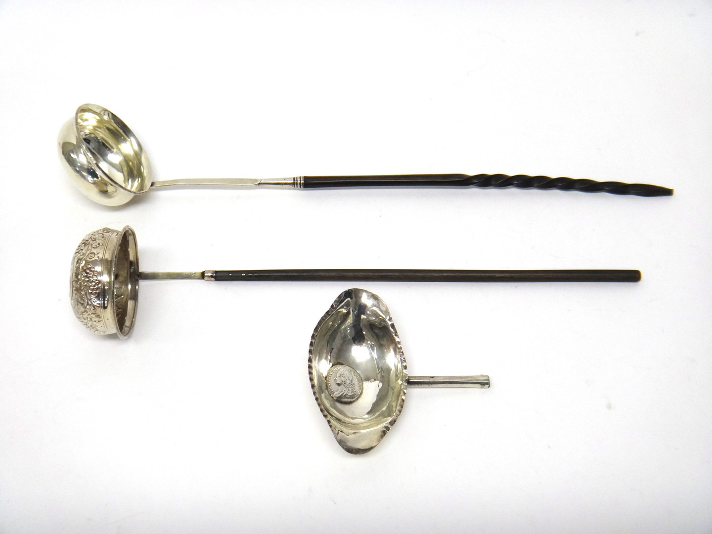 Appraisal: A silver toddy ladle mounted with a gilt Queen Anne