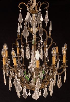 Appraisal: An Italian brass and cut glass twelve-light chandelier the scroll