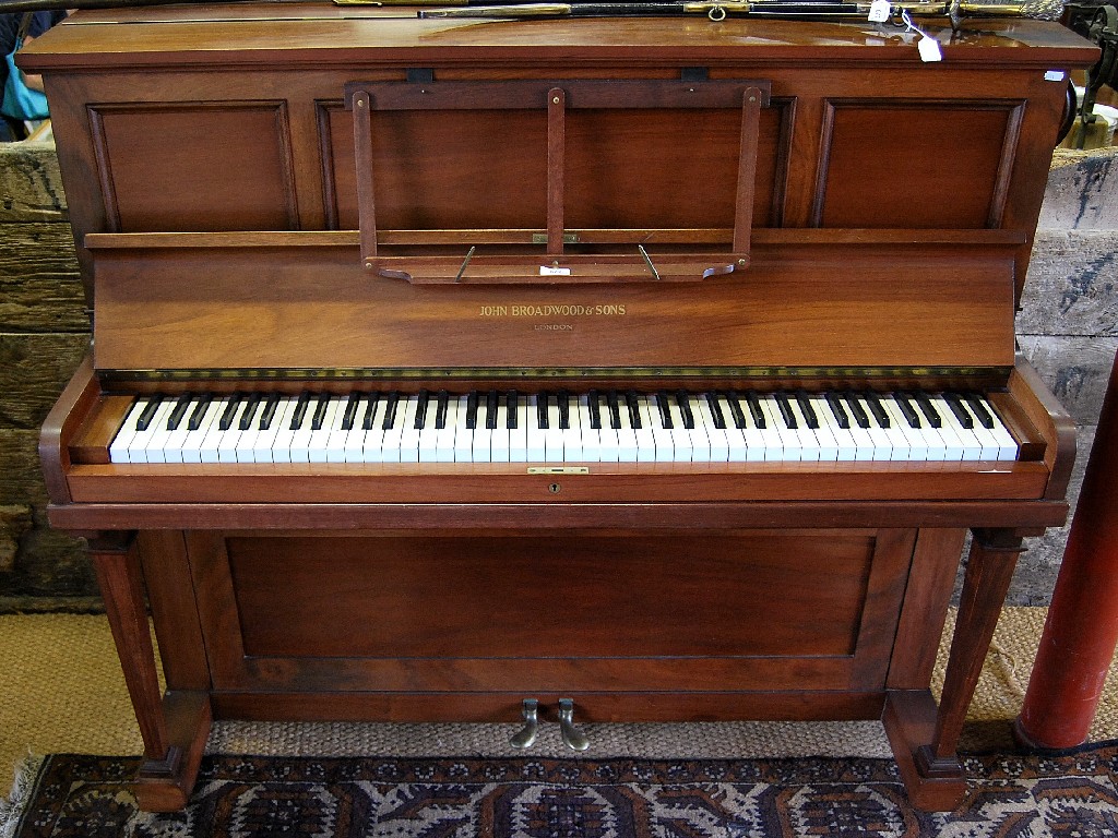 Appraisal: An iron framed mahogany cased upright piano by John Broadwood