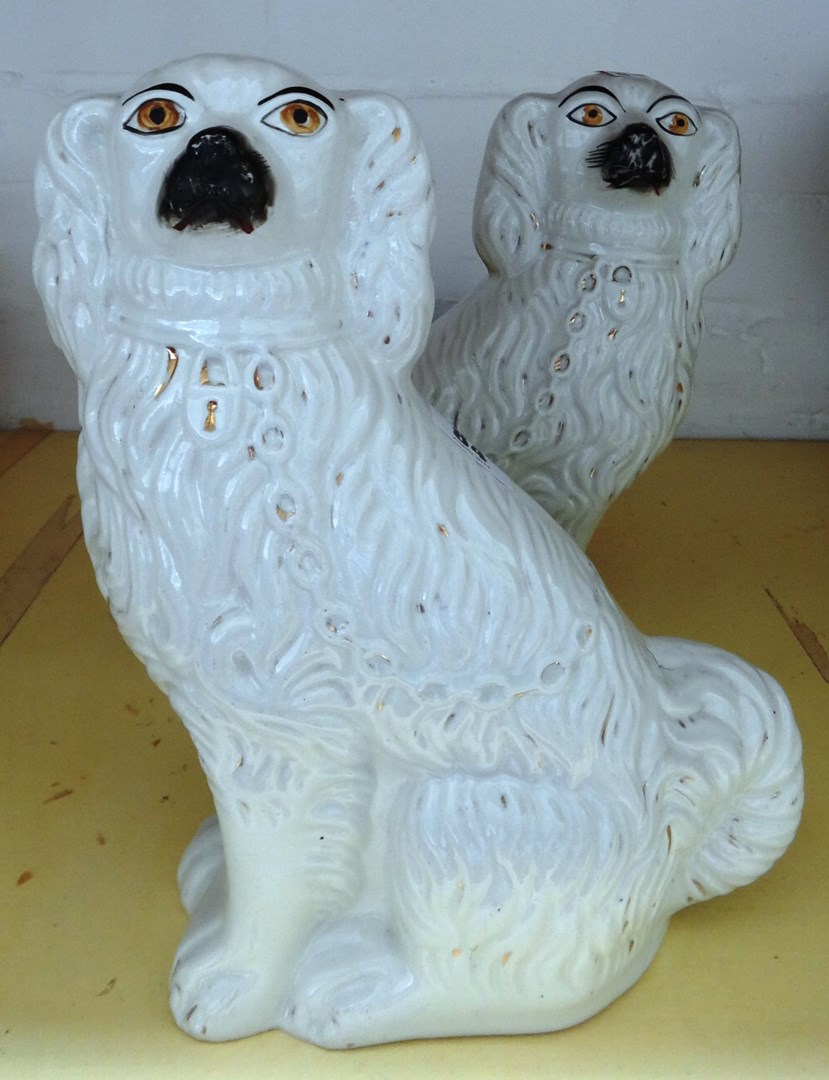 Appraisal: A pair of Staffordshire flatback spaniels late th century cm