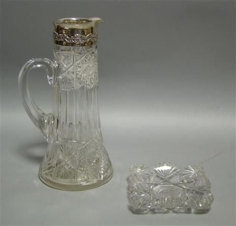 Appraisal: AMERICAN SILVER-MOUNTED CUT GLASS PITCHER th century the slender tapering