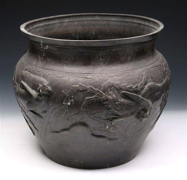 Appraisal: A JAPANESE BRONZE JARDINIERE cast with exotic birds flying above