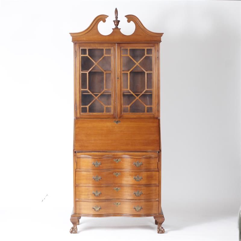 Appraisal: American secretary cabinet with lock claw feet and finial topper