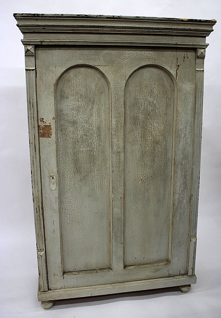 Appraisal: A LARGE CONTINENTAL PALE BLUE PAINTED CUPBOARD with single twin