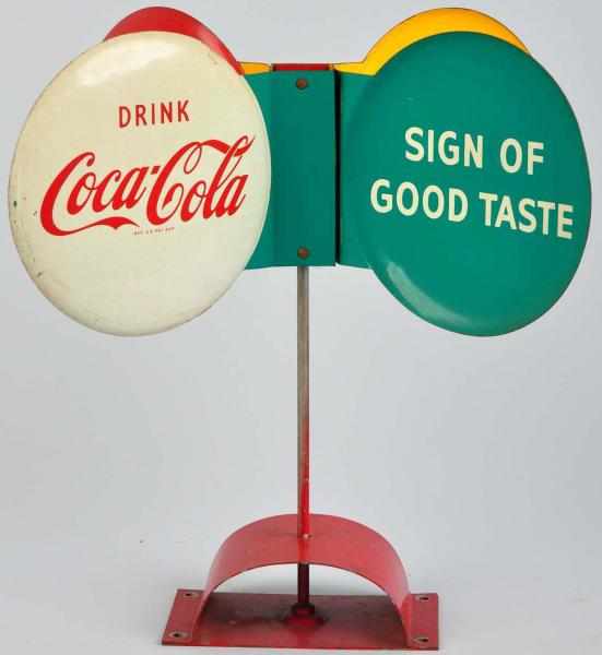 Appraisal: Tin Coca-Cola Whirligig Sign s Complete with original base that