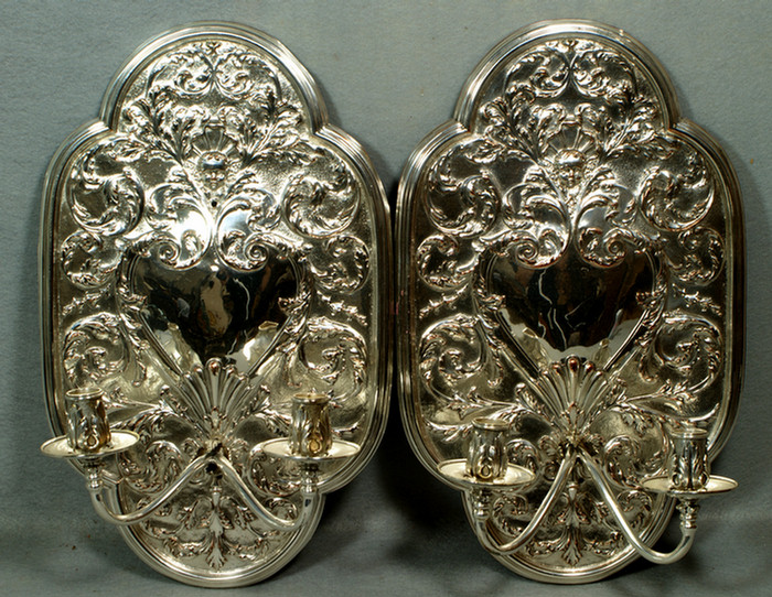 Appraisal: Pair of ornate silver plated copper sconces with cherub face