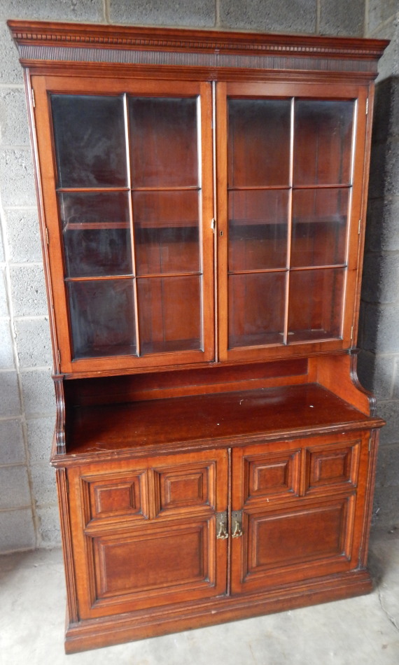 Appraisal: A principally early thC stained mahogany and walnut finish bookcase