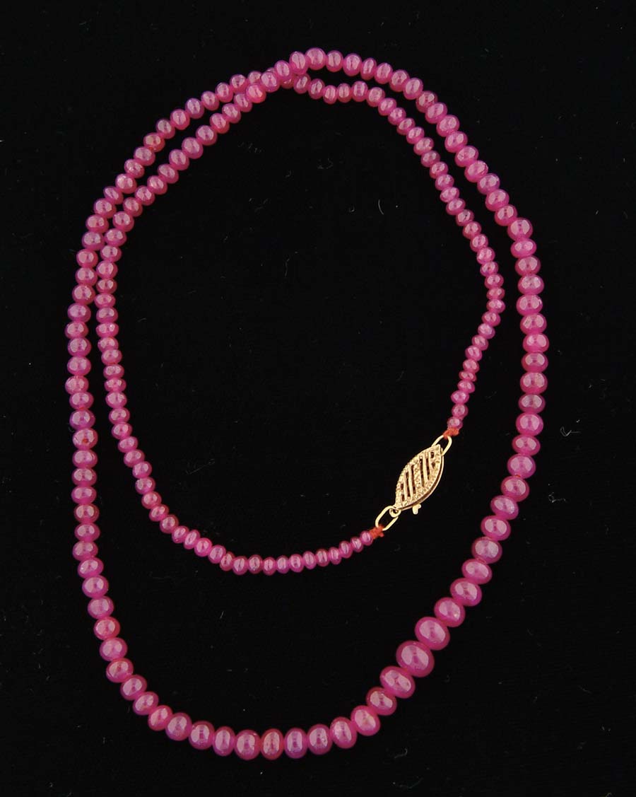 Appraisal: RUBY BEAD NECKLACE Graduated necklace Approximately small beads k yellow