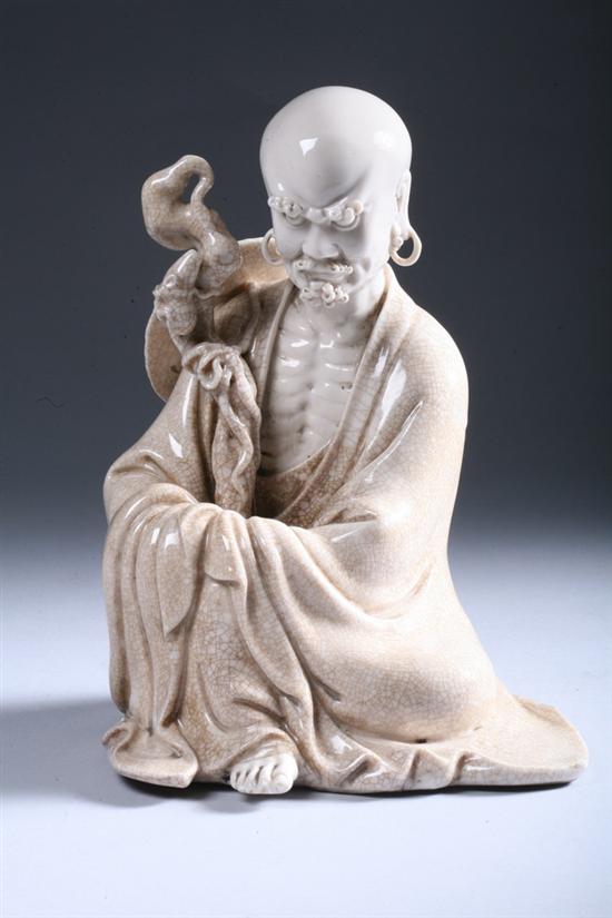 Appraisal: CHINESE CRACKLED BEIGE PORCELAIN FIGURE OF LOHAN th century Seated