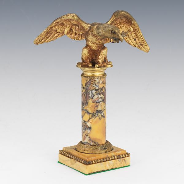 Appraisal: BRONZE EAGLE ON COLUMN CABINET SCULPTURE H Gilt bronze Empire