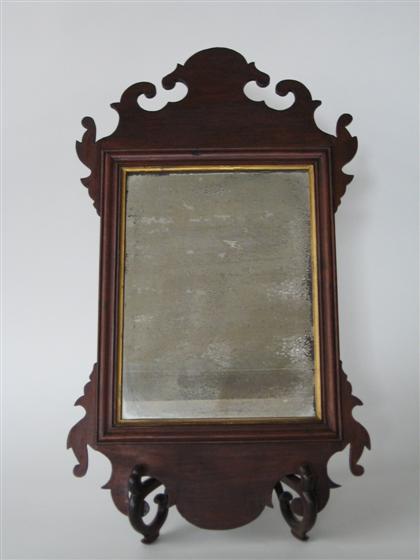 Appraisal: Chippendale mahogany looking glass th century With a scrolled cresting