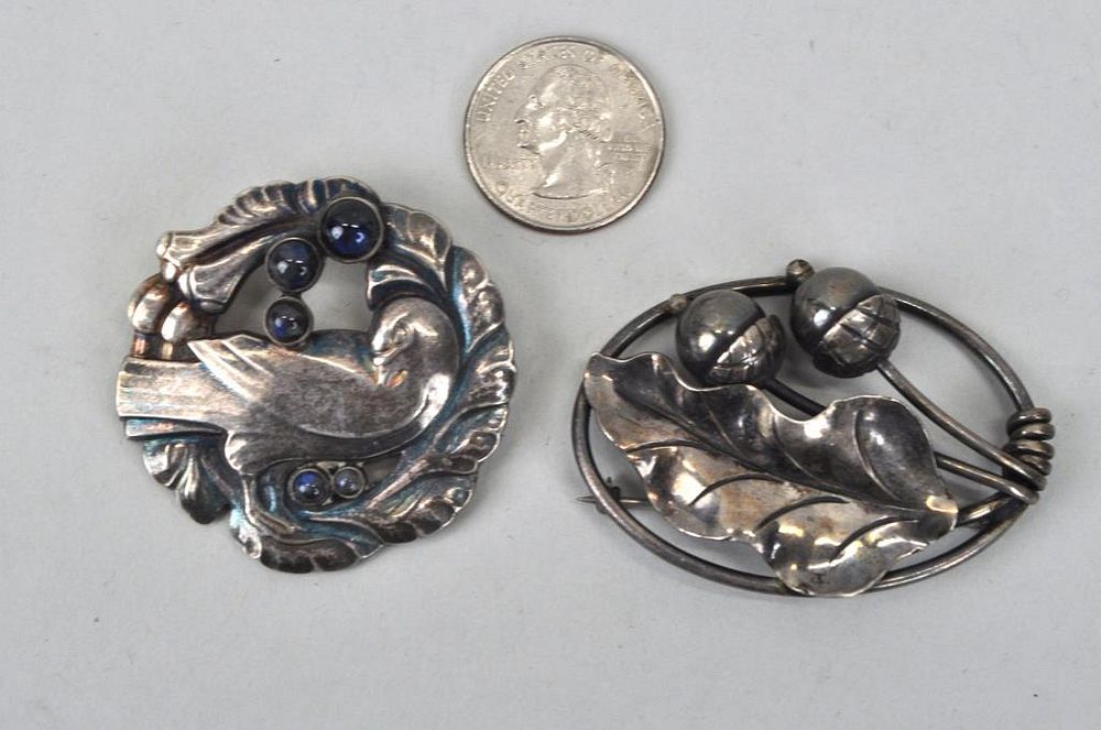 Appraisal: Two Georg Jensen Sterling Pins a bird with blue cabochons