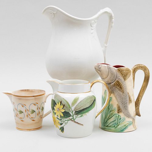 Appraisal: GROUP OF FOUR CERAMIC PITCHERSComprising A French majolica pitcher molded