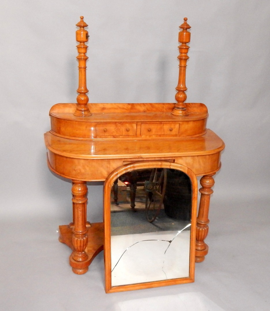 Appraisal: A Victorian satin walnut Duchess dressing table the domed swing