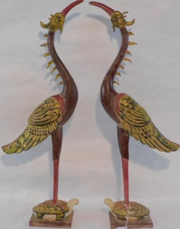 Appraisal: PAIR OF CARVED AND PAINTED CRANESstanding on turtles from Hanoi