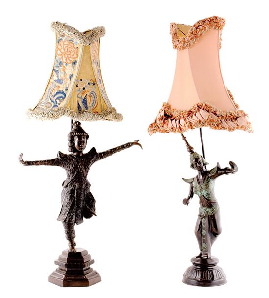 Appraisal: Oriental bronze figural lamps with custom shades early th century