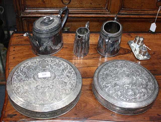 Appraisal: TWO MIDDLE EASTERN SILVER PLATED CIRCULAR SHAPED TINS decorated with