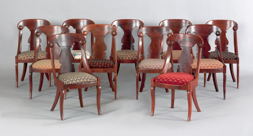 Appraisal: Set of eleven classical mahogany saber leg dining chairs ca