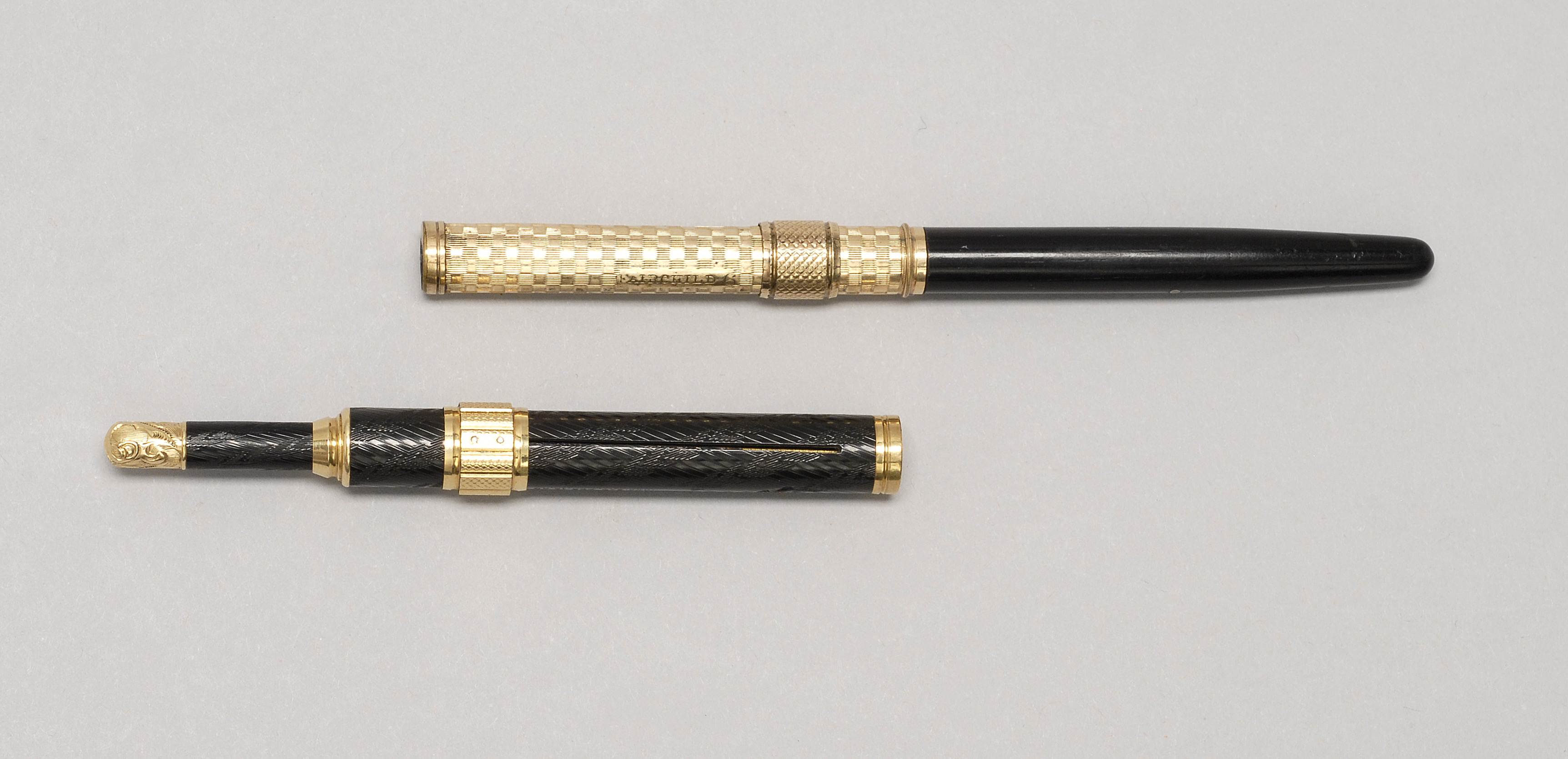 Appraisal: TWO GOLD-MOUNTED COMBINATION PENS PENCILS One by Fairchild marked Fairchild