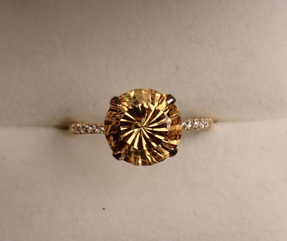 Appraisal: SMOKY CITRINE DIAMOND AND FOURTEEN KARAT GOLD RING The yellow