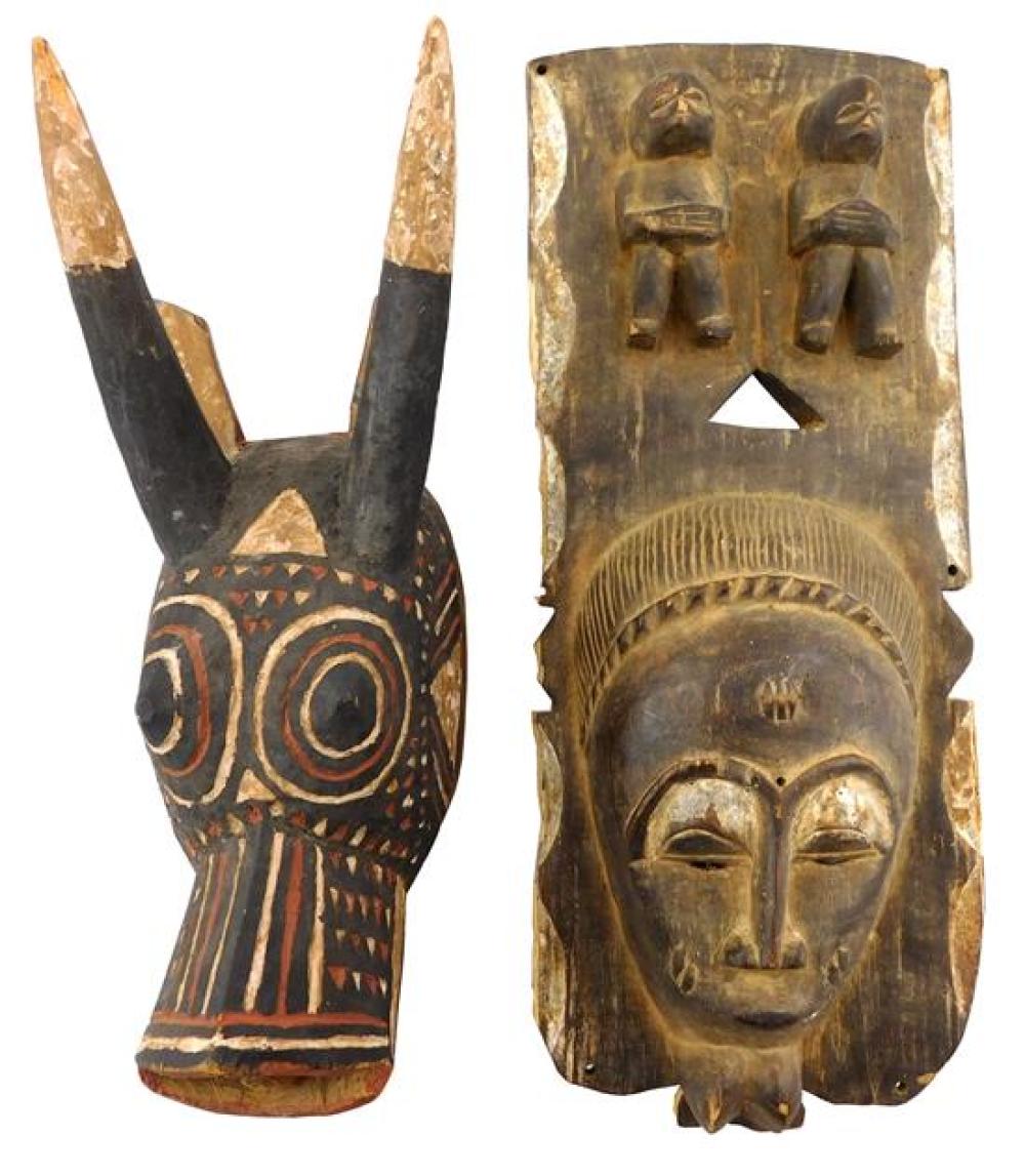 Appraisal: TRIBAL Two African carved wood masks made for the tourist