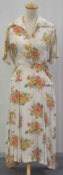 Appraisal: Day dress in beige floral printed rayon with pseudo pocket