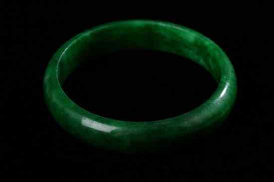 Appraisal: CHINESE APPLE GREEN AND EMERALD JADEITE BANGLE - Inside in