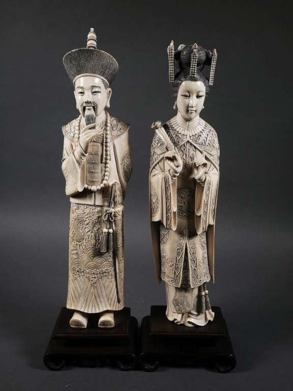 Appraisal: Carved antique ivory statues of a Chinese Emperor and Empress