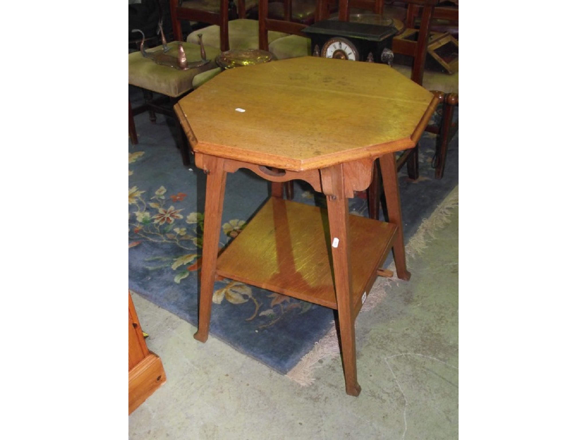 Appraisal: An Edwardian art and crafts oak occasional table with octagonal