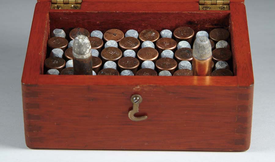 Appraisal: SMALL MAHOGANY WOODEN BOX CONTAINING ROUNDS OF FLAT HENRY CARTRIDGES