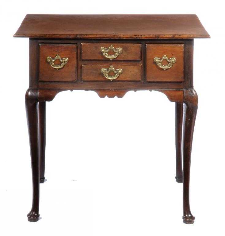 Appraisal: A GEORGE III YEW-WOOD LOWBOY with moulded top fitted with