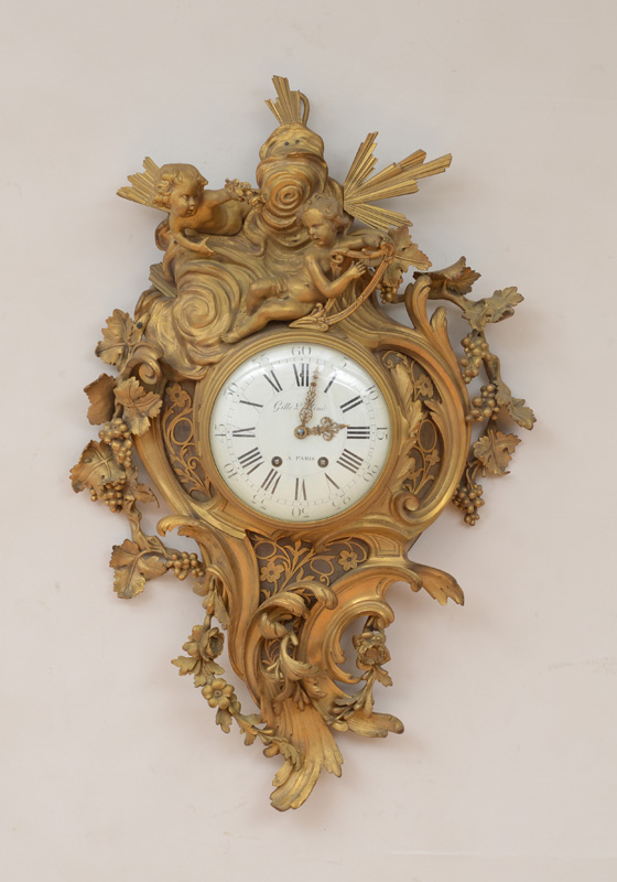 Appraisal: LOUIS XV STYLE GILT-BRONZE CARTEL CLOCK The in enamel dial