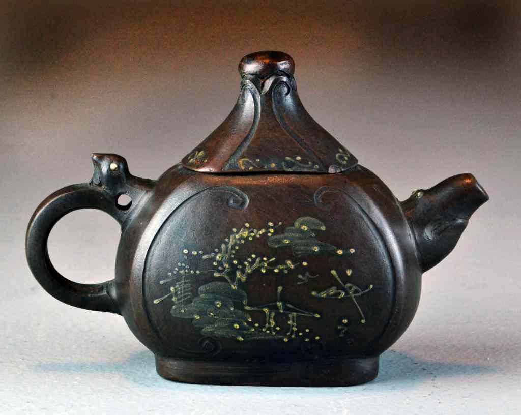 Appraisal: Chinese Yixing Pottery Tea PotSlip decorated depicting a landscape on