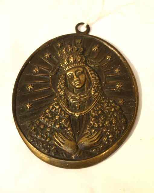 Appraisal: A RUSSIAN BRONZE ICON of shield form with chain support