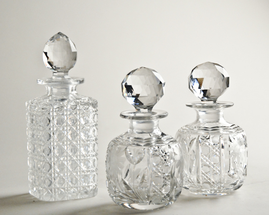 Appraisal: Three Cut Glass Cologne Bottles a matched pair with crosshatch