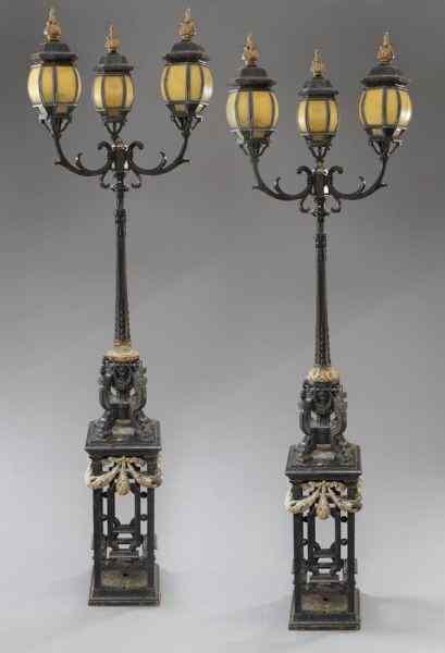 Appraisal: Pr wrought iron street lamps each with threelanterns with glass