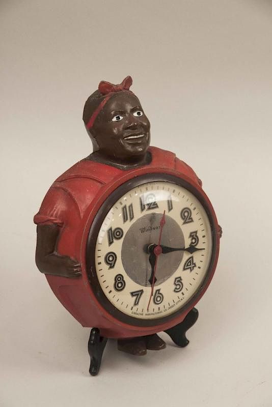 Appraisal: Black Americana Cast Metal Mammy Clock Cast metal Black Americana