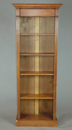 Appraisal: An oak freestanding open bookcase mid th century with fluted