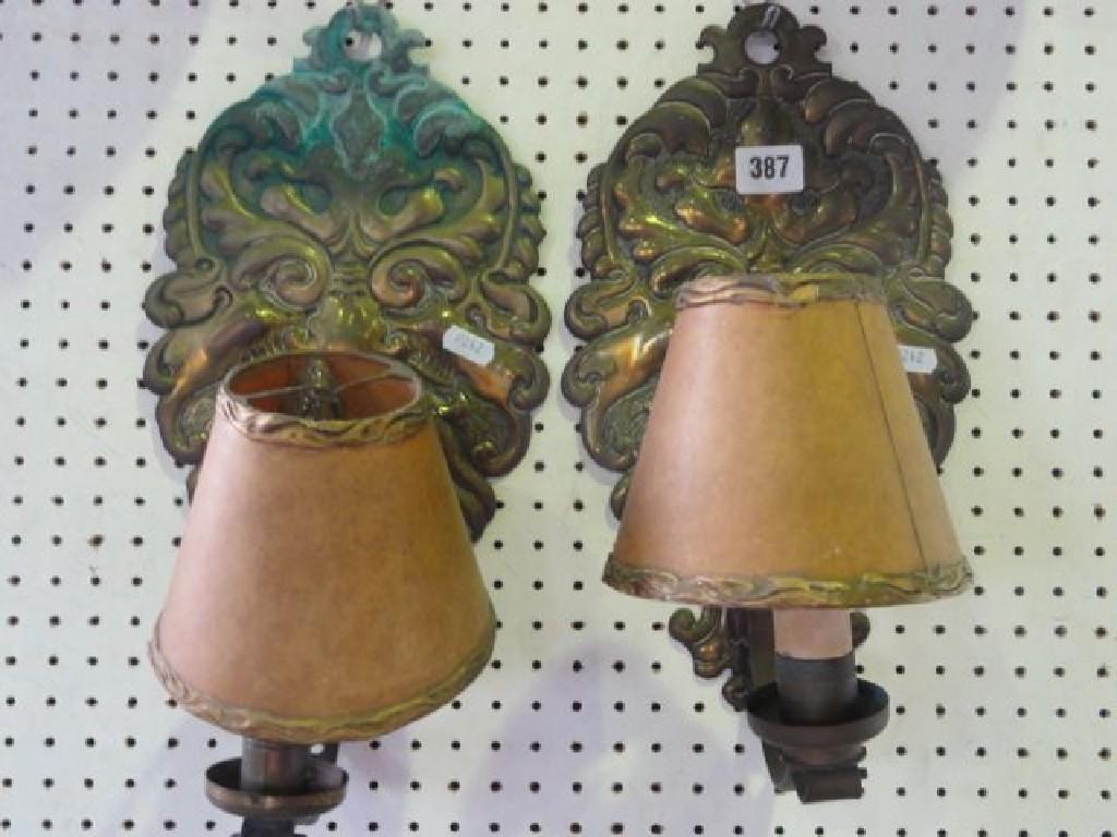 Appraisal: A pair of embossed glass wall sconces embossed backs with