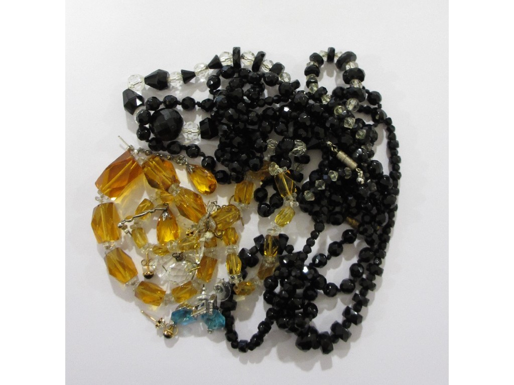 Appraisal: Lot comprising three strings of jet beads glass beads crystal