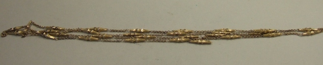 Appraisal: A Victorian gold long chain in a twin circular link